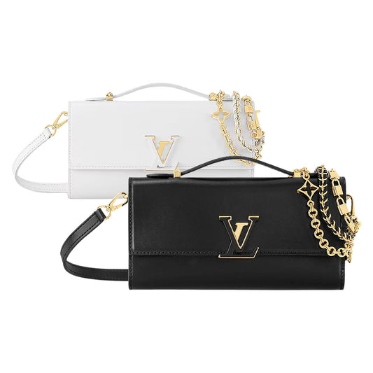 Black and white handbags with gold chains on a white background