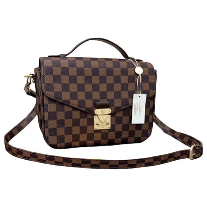 Brown checkered handbag with gold accents on a white background