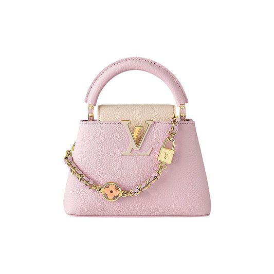 Pink handbag with gold chain and lock on a white background