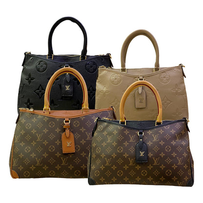 Four handbags in different colors with monogram pattern on a white background